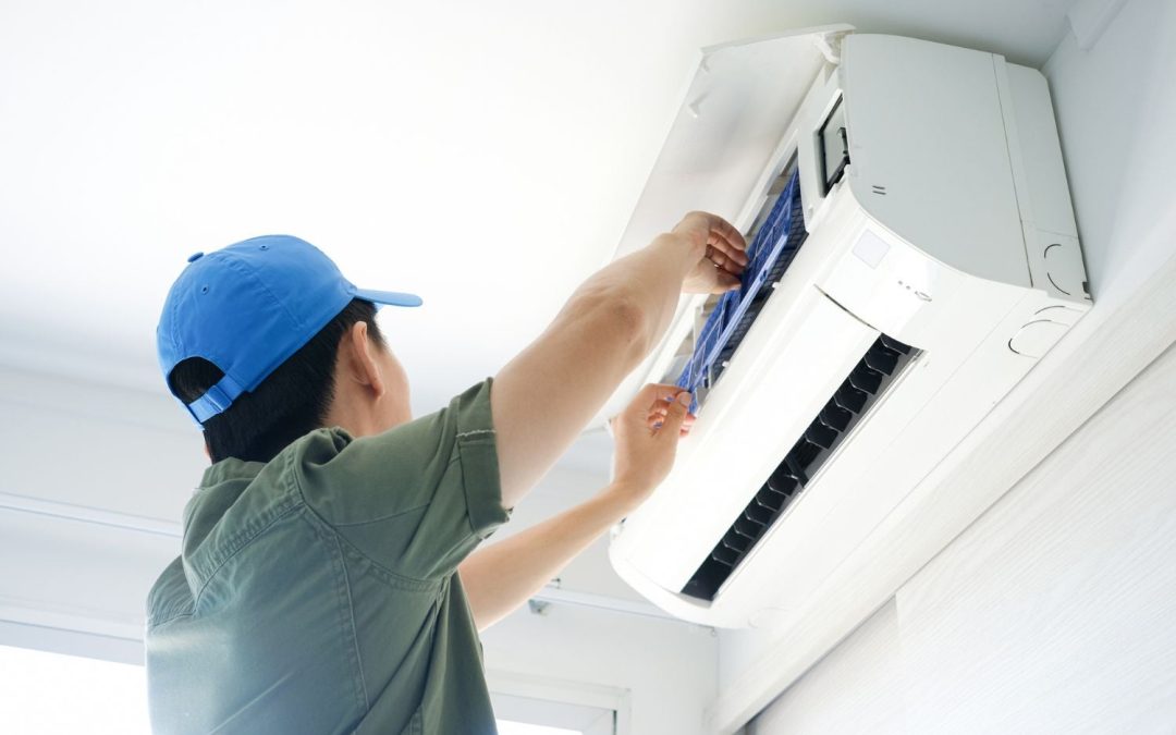 HVAC technician servicing a ductless mini split in Millbrae