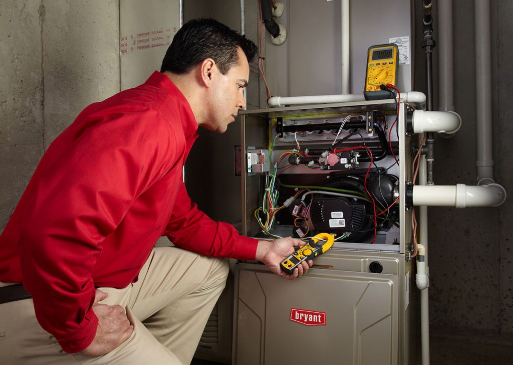 Heating technician diagnosing a furnace repair in Millbrae