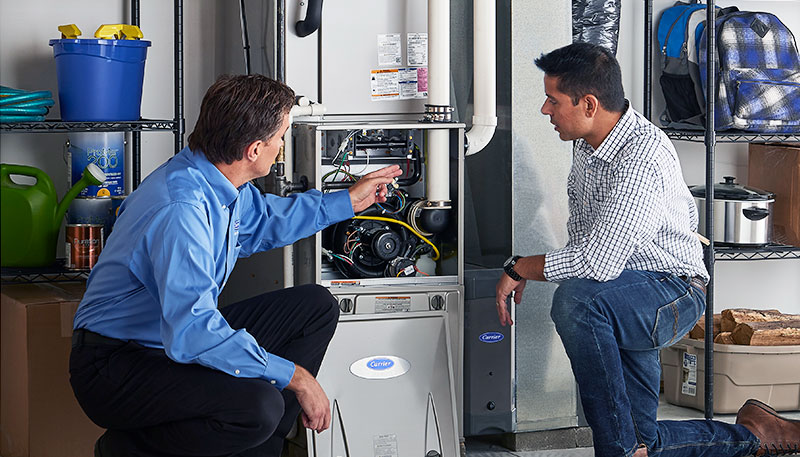 Technician evaluating a furnace for repair or replacement in Millbrae