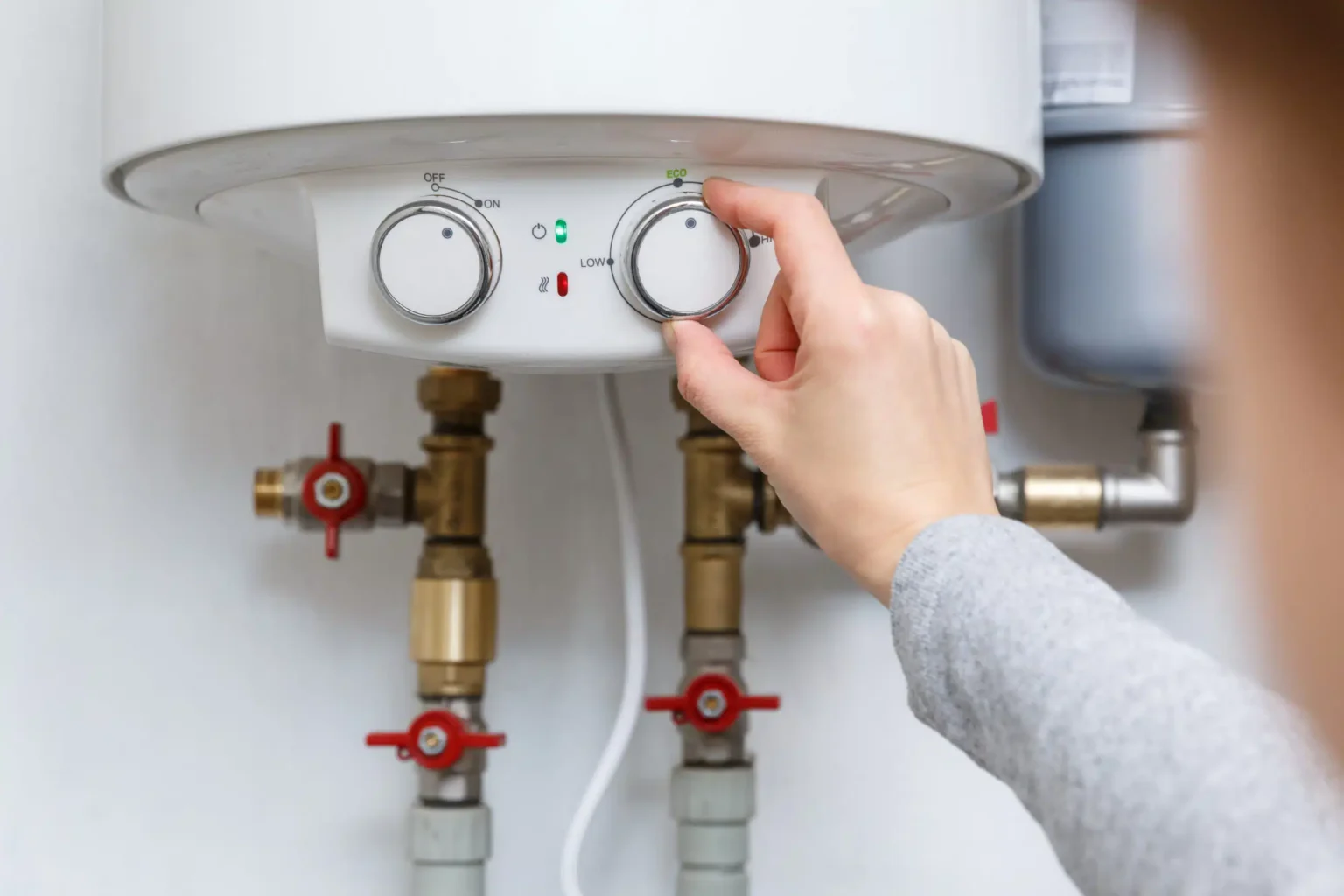 Technician adjusting a water heater in Millbrae